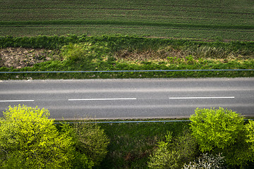 Image showing Asphalt road with white stripes