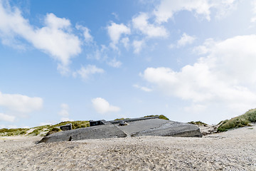 Image showing Ruin of a german bunker burried in the sand