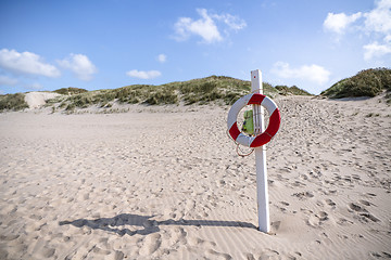 Image showing Lifesaver hanging on a post