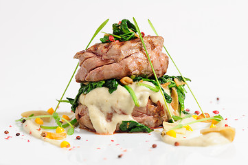 Image showing Veal medallions with spinach