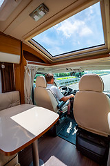 Image showing Man driving on a road in the Camper Van RV