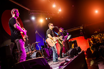 Image showing Band performs on stage in a nightclub