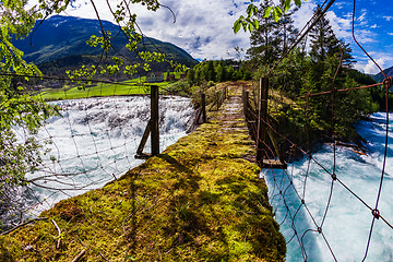 Image showing Suspension bridge over the mountain river, Norway.