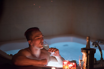 Image showing man relaxing in the jacuzzi