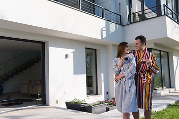 Image showing Young beautiful couple in bathrobes