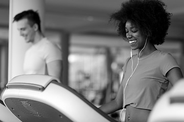 Image showing people exercisinng a cardio on treadmill