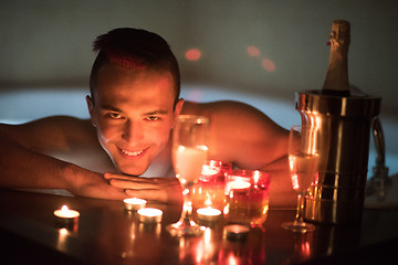 Image showing man relaxing in the jacuzzi