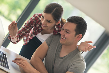 Image showing happy young couple buying online