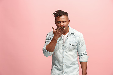 Image showing Portrait of attractive Afro-American man with air kiss isolated over pink background