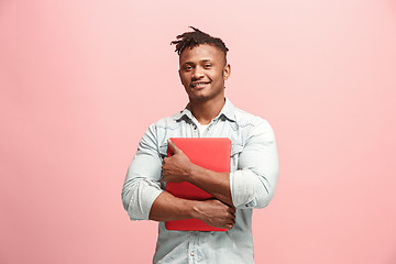 Image showing Afro-American Businessman hugging laptop