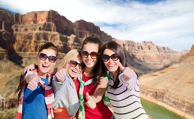 Image showing teenage girls or young women showing thumbs up