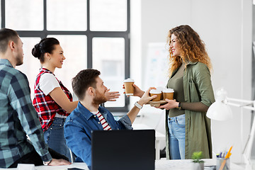 Image showing happy creative team with coffee working at office