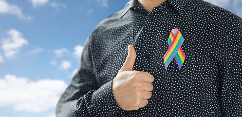 Image showing man with gay pride rainbow awareness ribbon