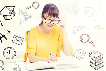 Image showing happy asian young woman student learning at home