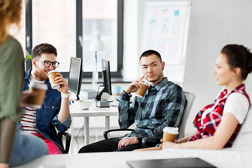 Image showing creative team drinking coffee at office