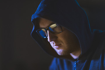 Image showing close up of hacker in glasses and hoodie