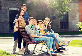 Image showing happy teenage students taking selfie by smartphone