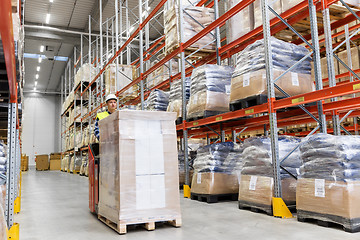 Image showing loader operating forklift at warehouse