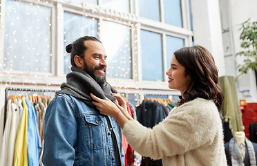 Image showing couple choosing clothes at vintage clothing store