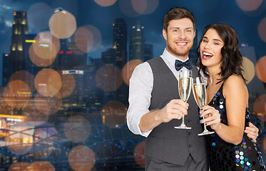 Image showing happy couple with champagne glasses at party