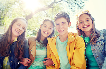 Image showing happy teenage students or friends outdoors