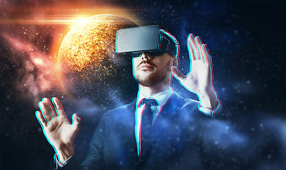 Image showing businessman in virtual reality headset over space