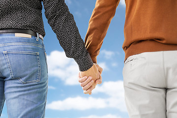 Image showing close up of male gay couple holding hands