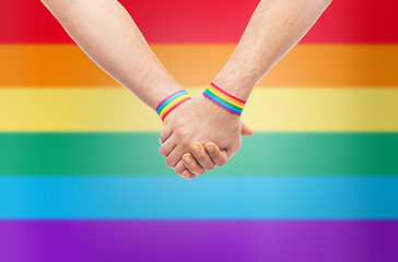 Image showing hands of couple with gay pride rainbow wristbands