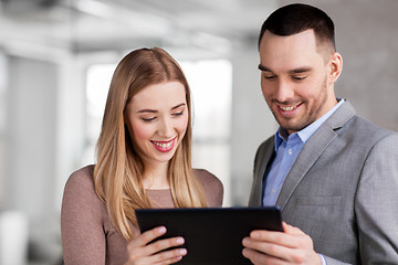 Image showing businesswoman and businessman with tablet pc