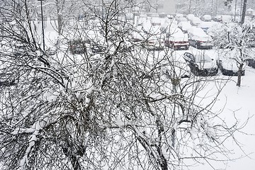 Image showing view from the window to the car parking in winter