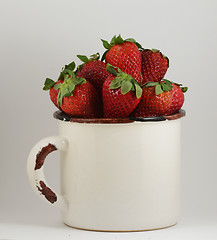 Image showing strawberry in a mug on white
