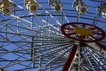 Image showing ferris wheel in amusement park on blue sky 