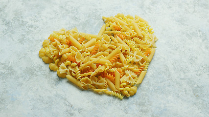 Image showing Different macaroni laid in shape of heart