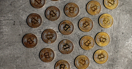 Image showing Golden bitcoins on gray surface