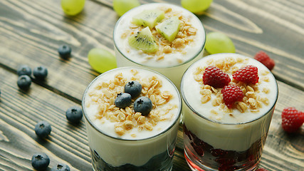 Image showing Glasses with fruit and yogurt desserts 