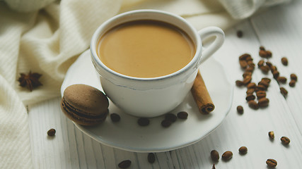 Image showing Cup of coffee with cookie and cinnamon