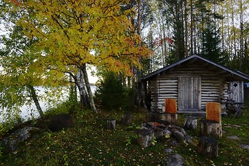 Image showing fishing hut and grill place on the shore of a lake