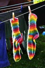 Image showing rainbow socks hang on the clothesline