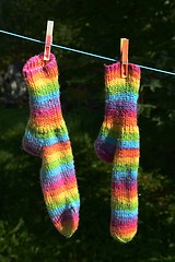 Image showing rainbow socks hang on the clothesline