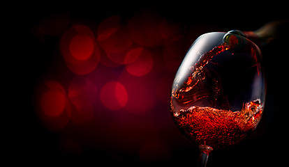 Image showing Wine on dark red