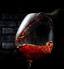 Image showing Wine on background of bricks