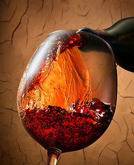 Image showing Red wine on clay background