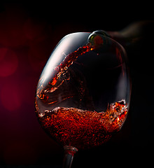 Image showing Wine on a red background