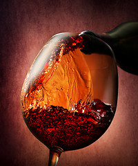 Image showing Wine on a burgundy background