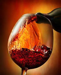 Image showing Red wine on an orange background