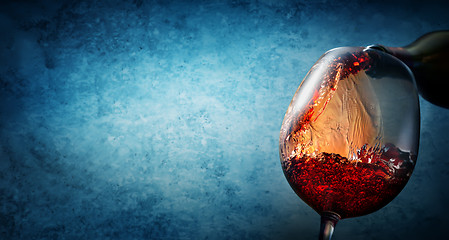 Image showing Wine on textured blue