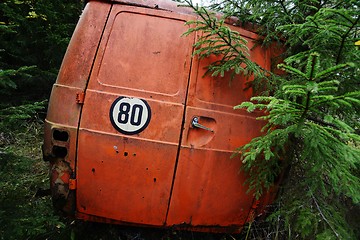 Image showing abandoned orange car in the forest