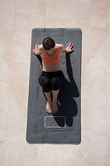 Image showing woman doing morning yoga exercises top view