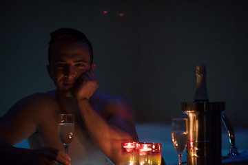 Image showing man relaxing in the jacuzzi