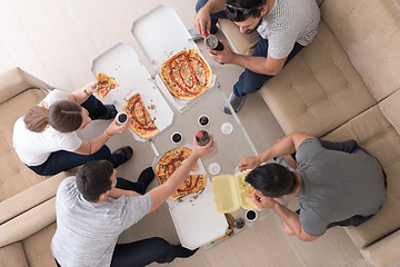 Image showing Pizza time a group of people